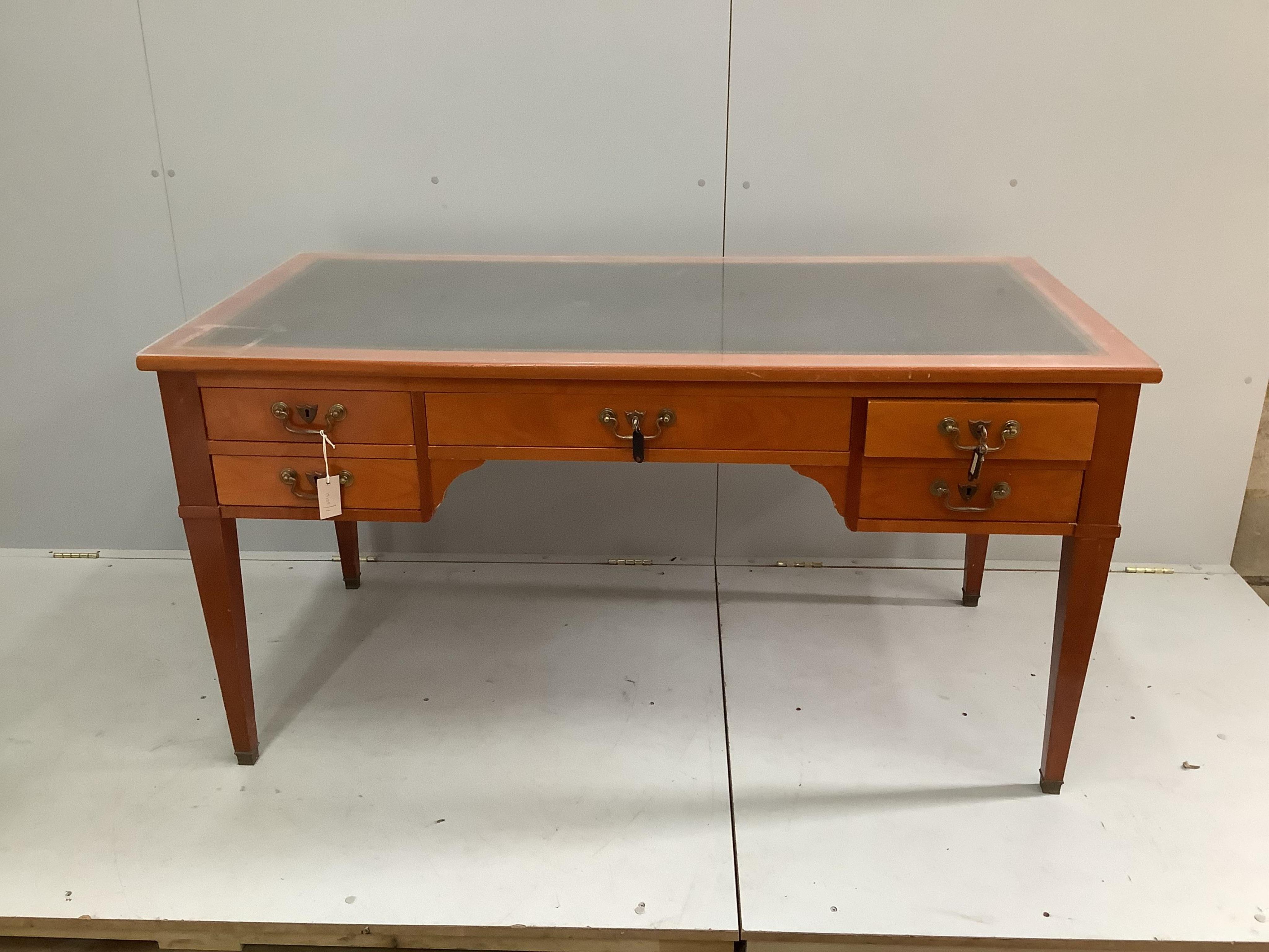 A reproduction cherry kneehole desk with green leather inset top, width 150cm, depth 74cm, height 76cm. Condition - good